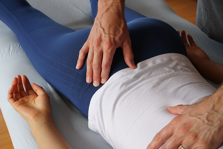 Acupressure massage therapy on the lower back.